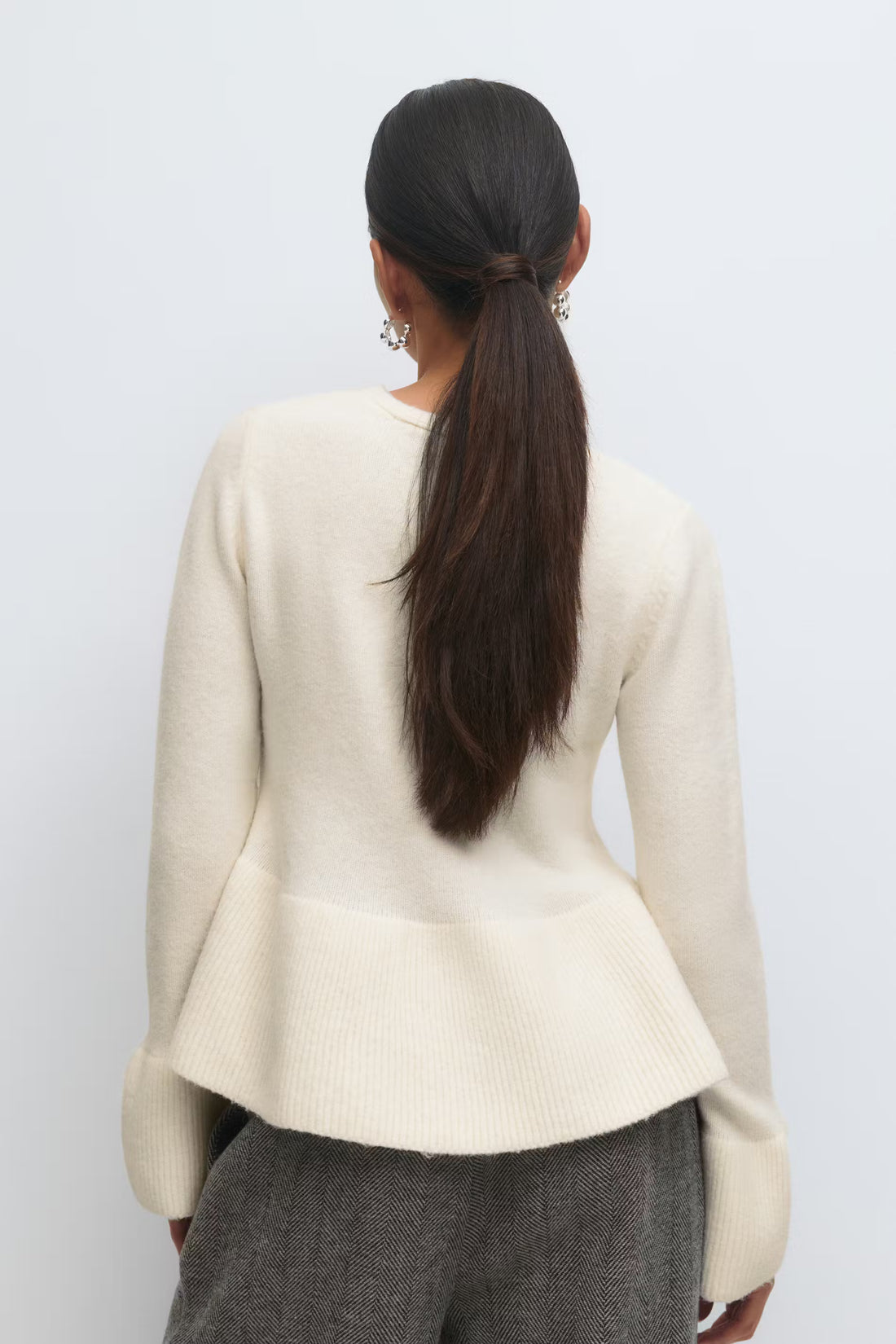 Knitted peplum cardigan